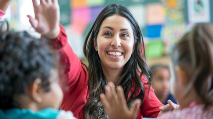 Fototapeta premium A teacher smiling at a student raising their hand in a classroom