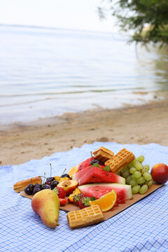 summer picnic on the seashore. healthy fruit snack