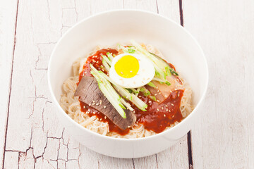  A food made by boiling ingredients such as onions and peppers, then pouring the cooled soy sauce over prepared crabs several times and allowing them to age.