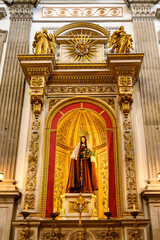 Virgin Mary figure on altar in the medieval Saint Francis Catholic Church, Porto, Portugal