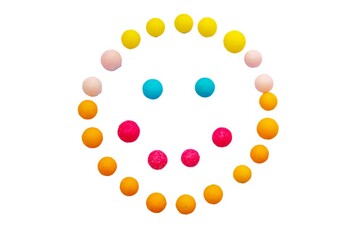 Smiling face made from colorful candy on white background. Kids dessert food happy meal. Don't worry, be happy