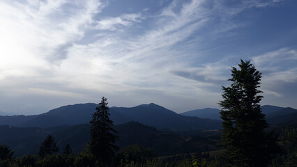 Beautiful sunset in the mountains. The early evening sun illuminates the mountains