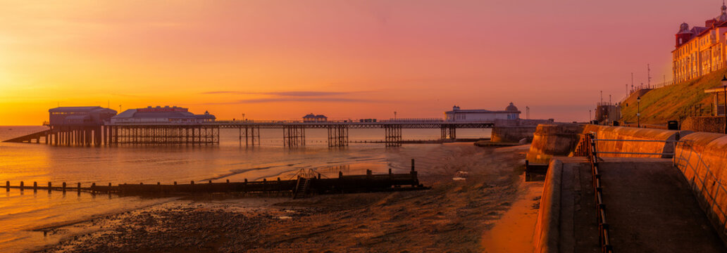 Panoramic view of Cromer pier at sunrise.