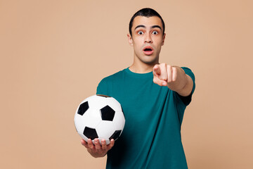 Young man fan wears basic blue t-shirt point finger camera on you cheer up support football sport...