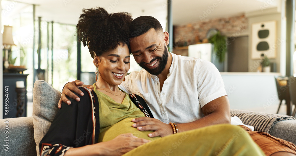 Wall mural Love, pregnancy and couple on sofa with hands on stomach for support, care and bonding in their home together.. Maternity, future or people in living room with belly growth, hug and child development