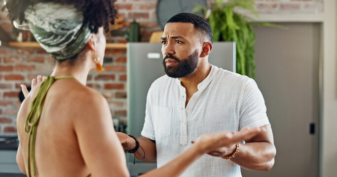 Divorce, fight and couple argue in a kitchen with stress, anger and cheating confrontation in their home. Marriage, conflict or frustrated people in a house with doubt, disaster or gaslighting crisis
