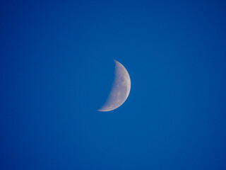 Quarter moon in blue sky