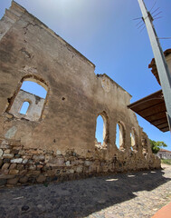 25.06.2024. Streets of Cunda Island in Balıkesir Turkey, on a sunny day. A section from the walls of Panaya Church. The church, which is an old historical building belonging to the Greeks.