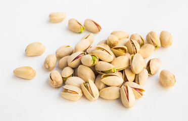 Roasted pistachios on white background