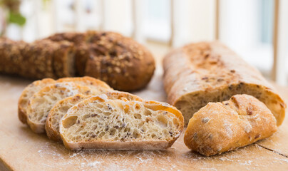 Fresh loaf of bread on wooden board