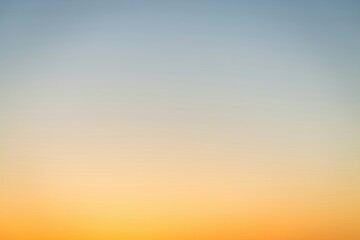 Sunset view over the ocean with a gradient background.