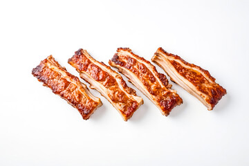 Four Pieces of Glazed Pork Ribs on a White Background