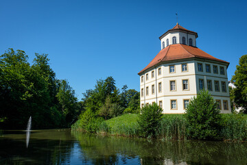 Fototapeta premium City hall of former water castle building with lake