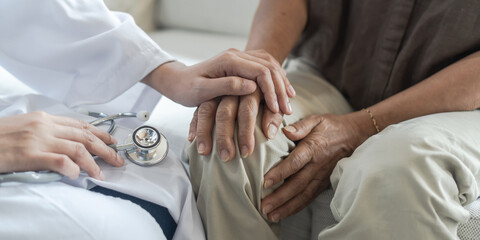 Parkinson disease, arthritis hand and knee joint pain, or osteoporosis bone  elder patient with geriatric or orthopedic doctor consulting examining old senior aged elderly woman in medical clinic room