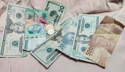 Indonesia Rupiah and U.S Dollar With Coins