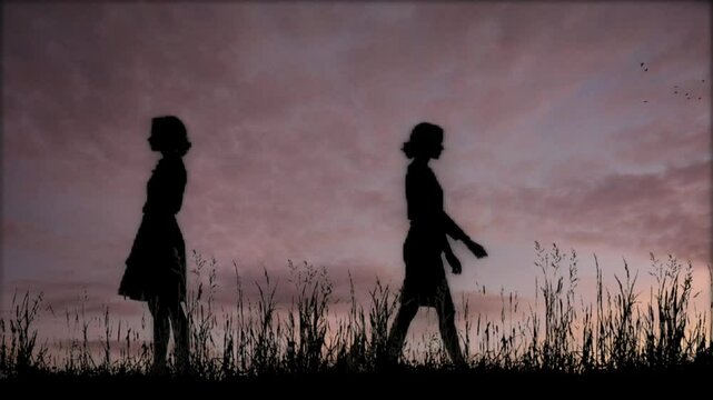 Silhouette of Two Women in the weeds, Artistic and Natural Scenery. Seamless looping 4k time-lapse virtual video background