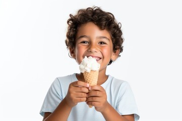 Boy holding dessert eating cream. 