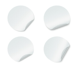 Blank round adhesive stickers set with curved corner. Realistic circle paper stickers with curved edges.  Empty mockup round sticky label. Vector illustration.