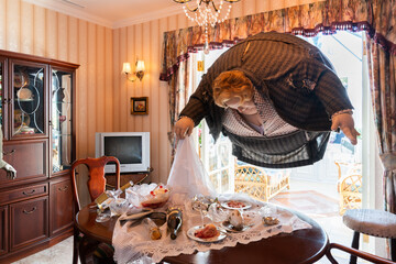 Fototapeta premium JAPAN - Nov 13, 2023: Aunt Marge Dursley fat lady floating over a dining table in a vintage living room creating whimsical and fantastical at Warner Bros. Studio Tour Tokyo, The Making of Harry Potter