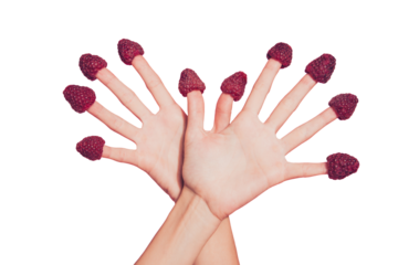 Close-up cropped delicate well-groomed two crossed hands ten fingers sweet berries hats on nails like wings isolated over pink pastel background