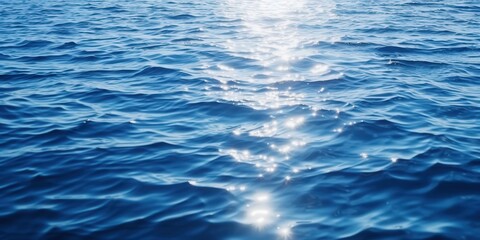 Naklejka premium Sparkling Ocean Water, sparkling sunlight reflecting on the deep blue sea