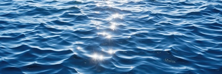 Obraz premium Sun Glints on the Rippling Ocean, sparkling sunlight reflecting on the deep blue sea