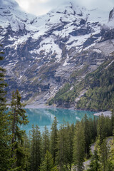 oeschinensee is the place where the tourist came to walk trek hike camp and picnic .there is many beautiful and amazing view point to take photo , kandersteg Switzerland  