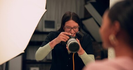 Happy woman, photographer and fun shoot with client for joyful or cheerful expression in studio. Friendly female person or producer talking to model for picture, photography or moment with camera