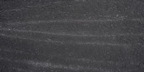 Fototapeta premium Asphalt Texture with Tire Tracks, A top view of asphalt texture, A flat surface of asphalt