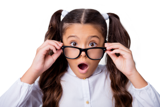 New school year program! Portrait of nice cute adorable lovely little small girl with curly ponytails in white formal blouse shirt, putting glasses down, opened mouth. Isolated over grey background