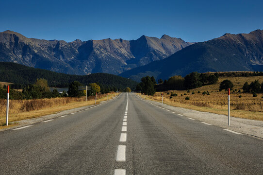 Straight road between La Quillane and Les Angles. In the background, the mountains of the Eastern Pyrenees between Cambredase and Puig de Gallin&agrave;s (Pyr&eacute;n&eacute;es Orientales, France)