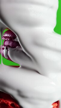 Green background. Stock clip.Maccaroons of different colors are watered,which is watered with white sugar.