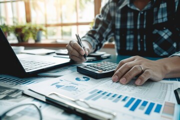 Business man accountant calculates bugget with calculator