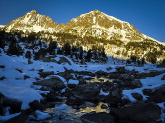 Pic Alt de Cubil and Pic Baix de Cubil peaks in a winter sunrise (Pessons cirque, Andorra, Pyrenees)
