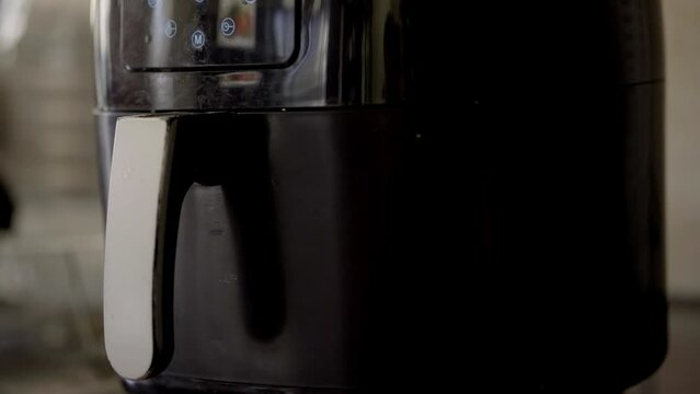 An air fryer cooking healthy food