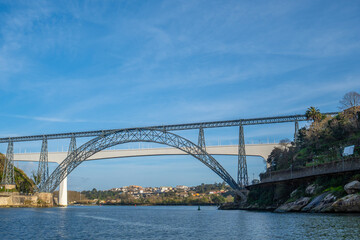 Fototapeta premium Maria Pia Bridge over Douro River Porto Portugal with the Ponte da Arrabida bridge seen in the background