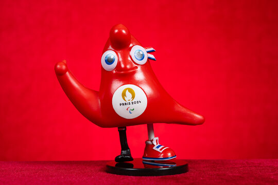 ZHONGSHAN China-June 13 2024: 2024 Paris Paralympic Games mascot the Phryge on red background at horizontal composition.