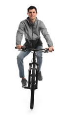 Smiling man riding bicycle on white background