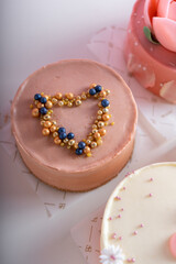 Cakes Assortment, Bento Cakes on Light Pink Background