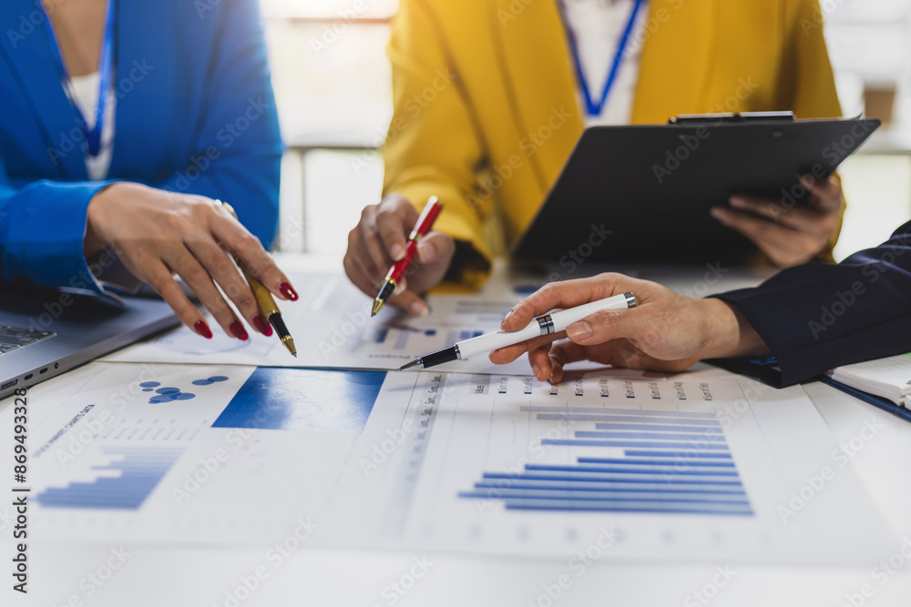 Wall mural meeting business consultants is discussing the analysis financial charts in company reports and anal