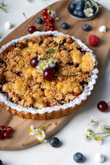 Freshly Baked Cherry Crumble Pie, Berry Pie over Summer Background