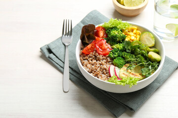 Healthy meal. Tasty products in bowl on white table, space for text