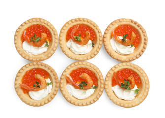 Delicious canapes with shrimps, red caviar and cream cheese isolated on white, top view