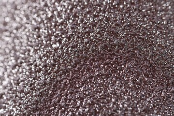 Texture of coarse sandpaper as background, closeup
