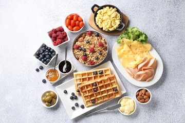 Tasty breakfast. Flat lay composition with many different food on grey textured table