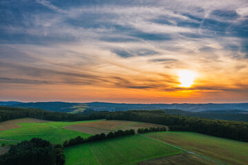 Sunset over the fields and forests of the Taunus
