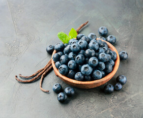 Blueberries with vanilla stick