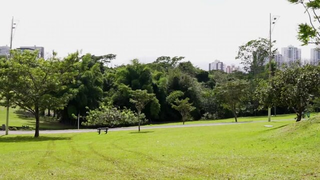Outdoor park full of trees and a green lawn, park of the indigenous nations in Campo Grande, Mato Grosso do Sul, Brazil.