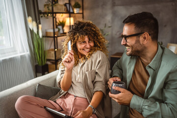 Boyfriend and girlfriend buy online on tablet use credit card at home