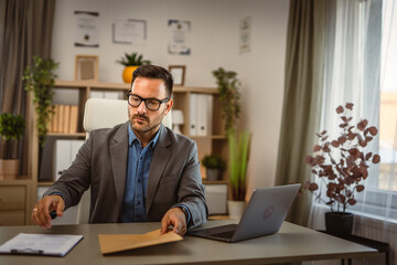 businessman prepare the document for sent in an envelope post